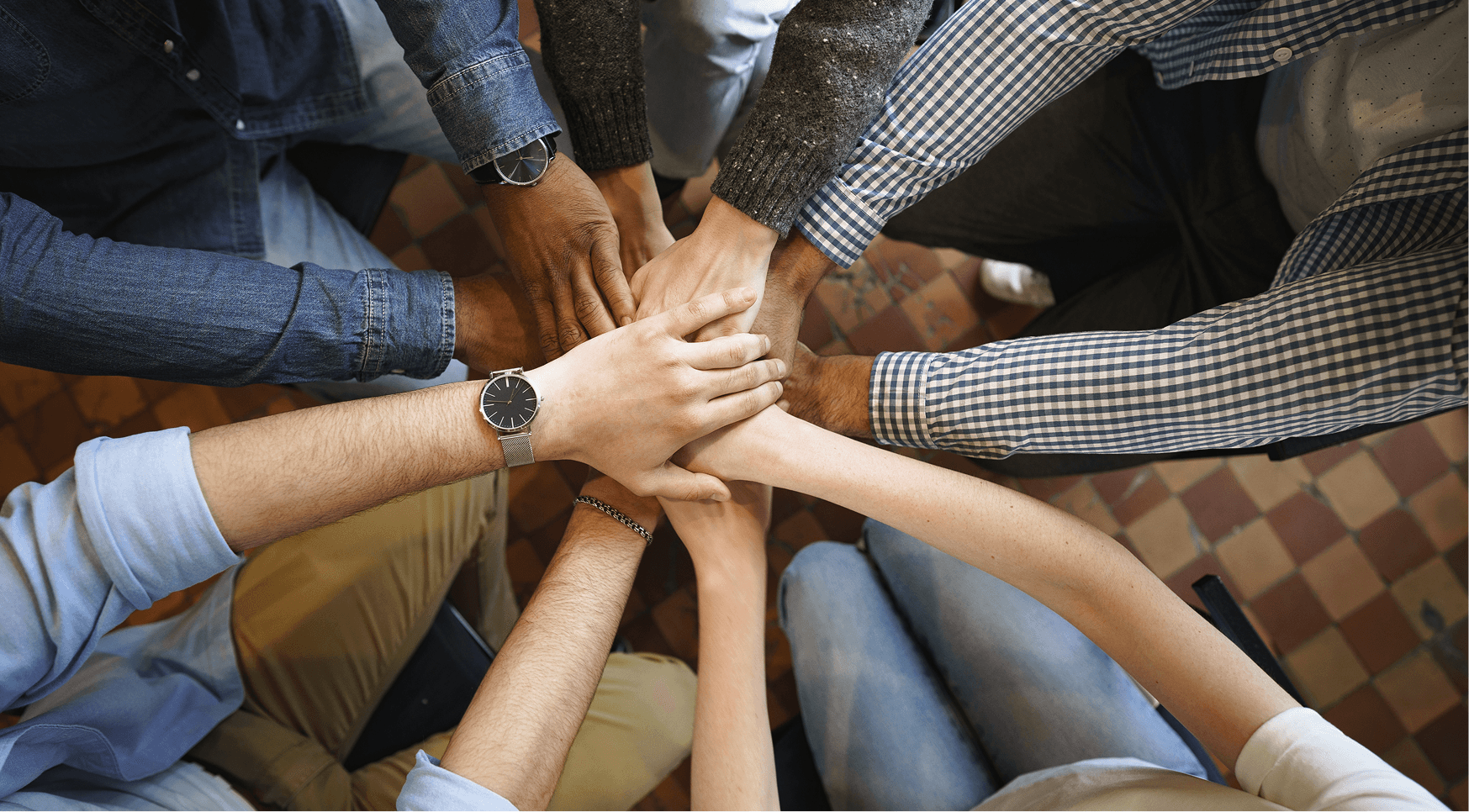 Hands together in a team huddle
