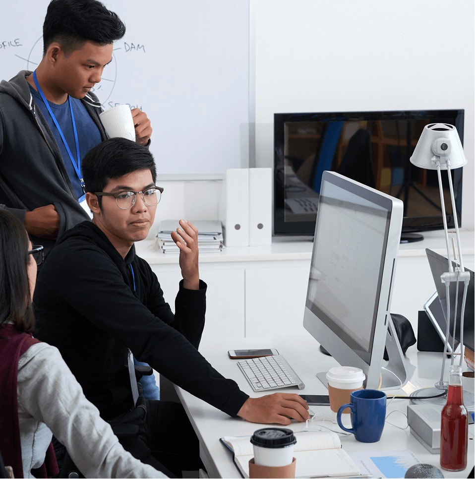 Colleagues collaborating at a computer